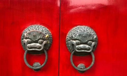 red door with luck dragons